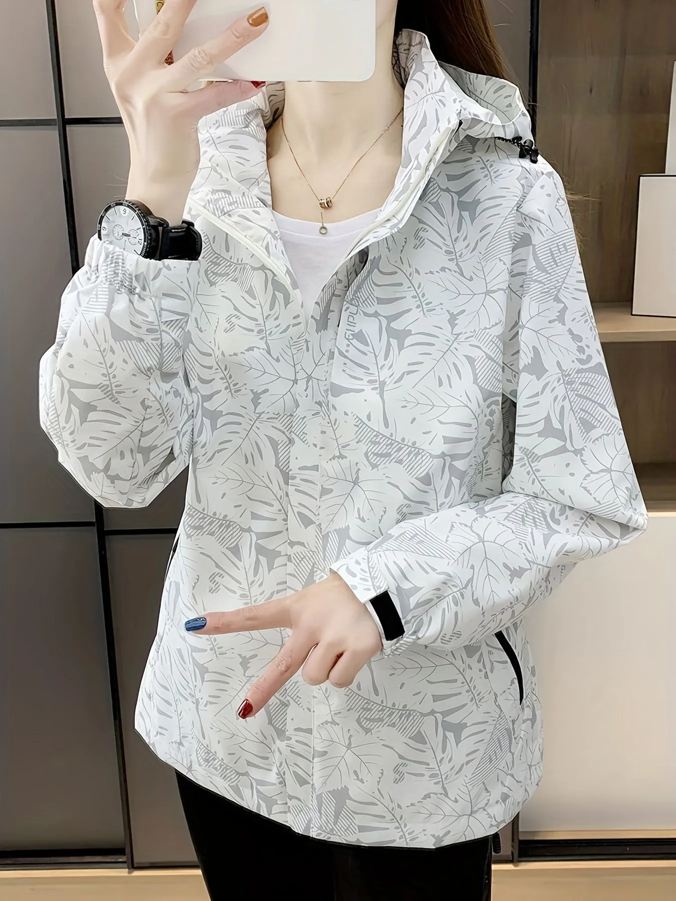 Stylish Leaf Print Windbreaker Jacket - Waterproof, Breathable, and Packable - Women's Outdoor Rain Jacket with Removable Hood and Adjustable Cuffs for Hiking, Camping, and Travel