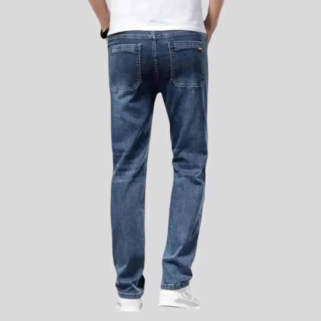 Whiskered men's mid-waist jeans