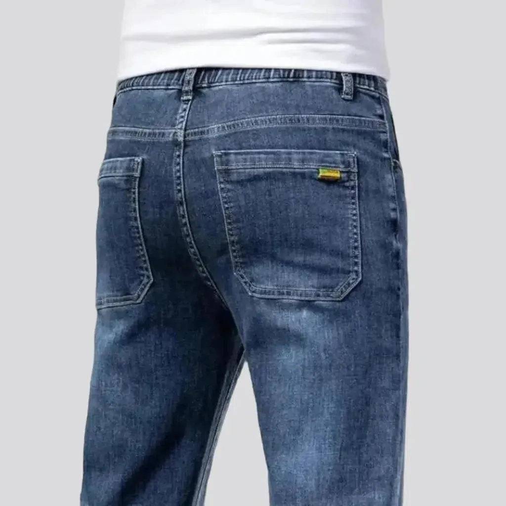 Whiskered men's mid-waist jeans